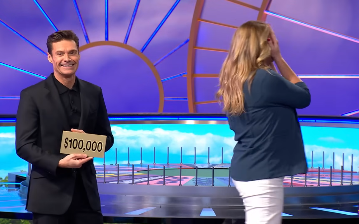 Show host Ryan Seacrest and contestant Kristyn Hobbs in a 'Wheel of Fortune' episode, Photo Credit: Wheel of Fortune/Youtube