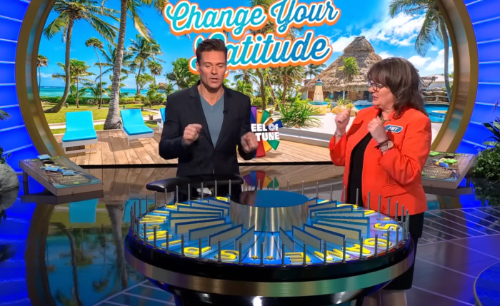 Show host Ryan Seacrest and contestant Amy Johnston in a 'Wheel of Fortune' episode, Photo Credit: Wheel of Fortune/Youtube