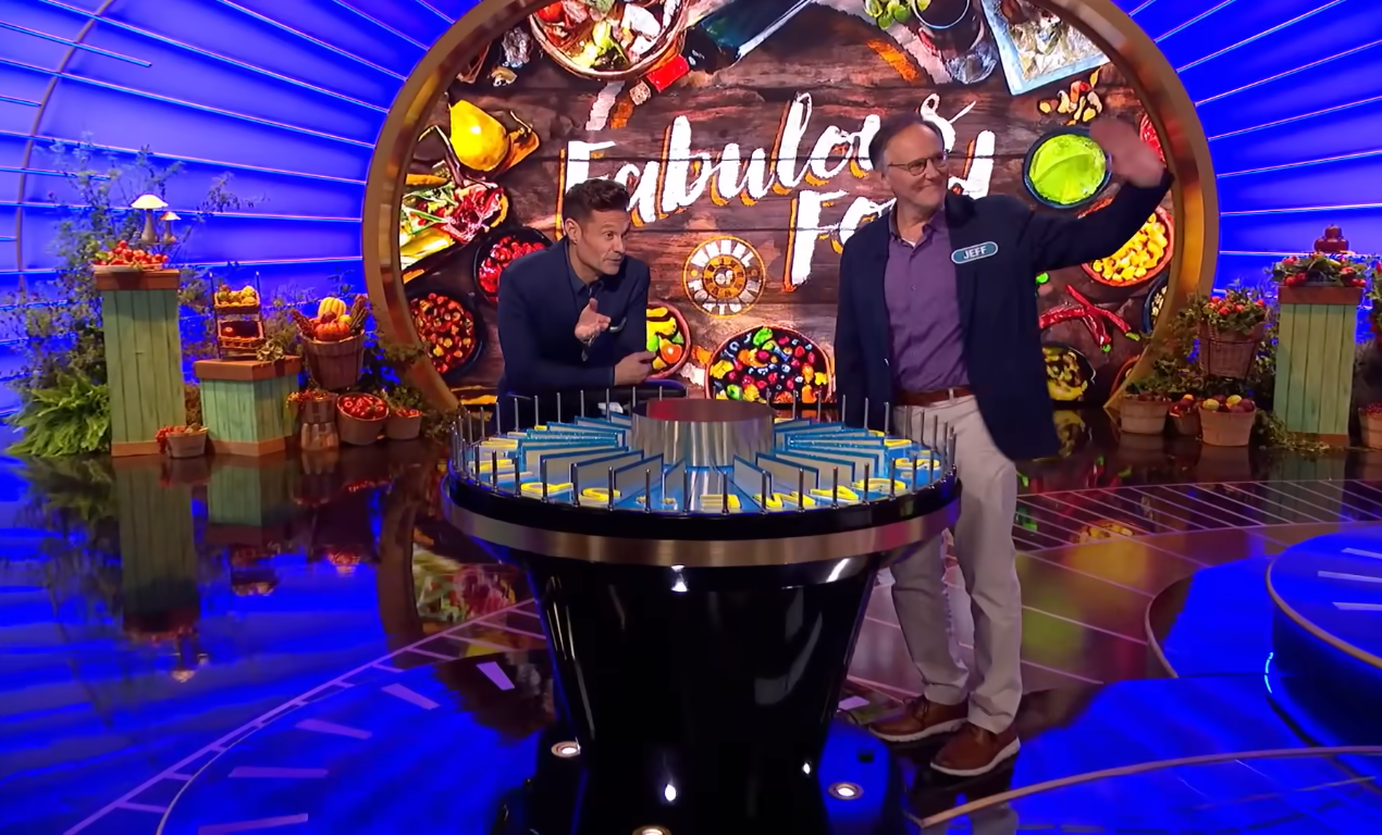 Show host Ryan Seacrest and contestant Jeff Richardson in a 'Wheel of Fortune' episode, Photo Credit: Wheel of Fortune/Youtube