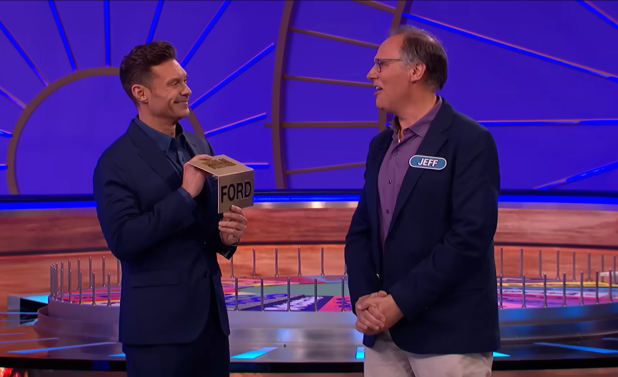 Show host Ryan Seacrest and contestant Jeff Richardson in a 'Wheel of Fortune' episode, Photo Credit: Wheel of Fortune/Youtube