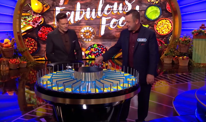 Show host Ryan Seacrest and contestant Clint Ingalls in a 'Wheel of Fortune' episode, Photo Credit: Wheel Of Fortune/Youtube