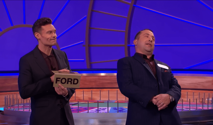 Show host Ryan Seacrest and contestant Clint Ingalls in a 'Wheel of Fortune' episode, Photo Credit: Wheel Of Fortune/Youtube