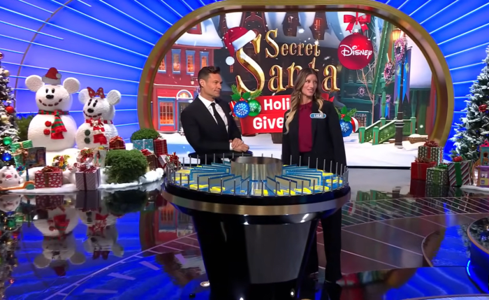 Show host Ryan Seacrest and contestant Wanda Lisa Santangelo in a 'Wheel of Fortune' episode, Photo Credit: Wheel Of Fortune/Youtube