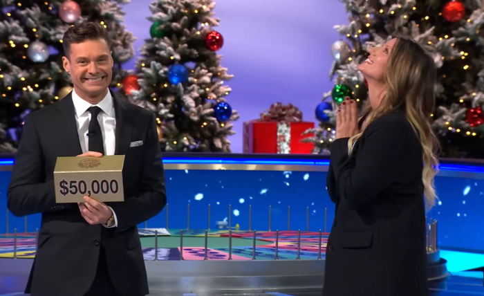 Show host Ryan Seacrest and contestant Wanda Lisa Santangelo in a 'Wheel of Fortune' episode, Photo Credit: Wheel Of Fortune/Youtube