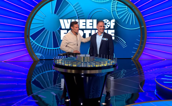Show host Ryan Seacrest and contestant Joe Ferroni in a 'Wheel of Fortune' episode, Photo Credit: Wheel of Fortune/Youtube