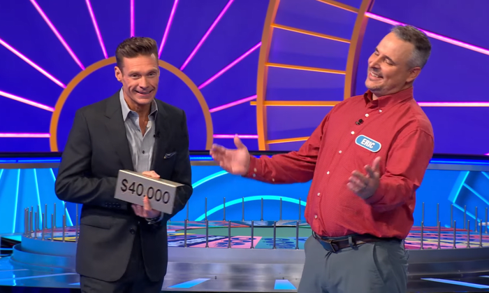 Show host Ryan Seacrest and contestant Eric Handzel in a 'Wheel of Fortune' episode, Photo Credit: Wheel Of Fortune/Youtube