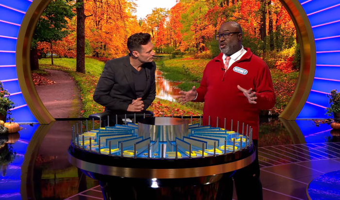 Show host Ryan Seacrest and contestant Rodney Flippen in a 'Wheel of Fortune' episode, Photo Credit: Wheel of Fortune/Youtube