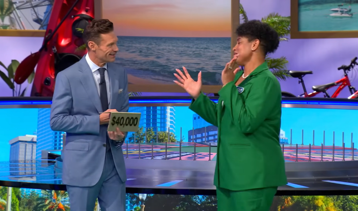 Show host Ryan Seacrest and contestant Cherie Noisette in a 'Wheel of Fortune' episode, Photo Credit: Wheel of Fortune/Youtube