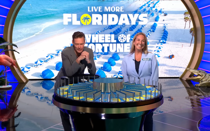 Show host Ryan Seacrest and contestant Kelly Amodio in a 'Wheel of Fortune' episode, Photo Credit: Wheel of Fortune/Youtube