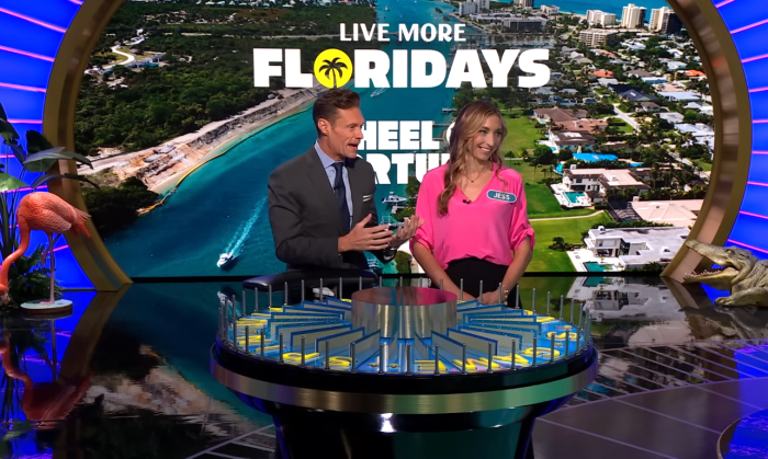 Show host Ryan Seacrest and contestant Jess Perri in a 'Wheel of Fortune' episode, Photo Credit: Wheel of Fortune/Youtube