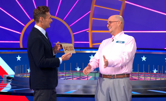 Show host Ryan Seacrest and contestant Ron Sheppard in a 'Wheel of Fortune' episode, Photo Credit: Wheel of Fortune/Youtube