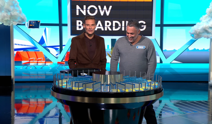 Show host Ryan Seacrest and contestant Greg Swiszcz in a 'Wheel of Fortune' episode, Photo Credit: Wheel of Fortune/Youtube