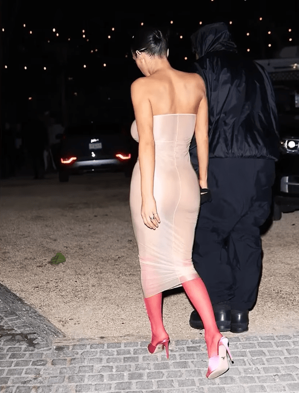 Bianca Censori walking with her husband Kanye West in a revealing dress, Photo Credit: Page Six/Youtube