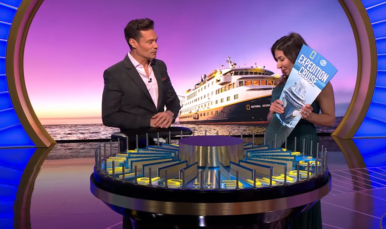 Ryan Seacrest and Genna Root in a 'Wheel of Fortune' episode, Photo Credit: Wheel of Fortune/Youtube