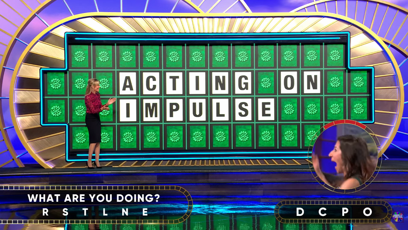 Show hostess Vanna White in a 'Wheel of Fortune' episode, Photo Credit: Wheel of Fortune/Youtube