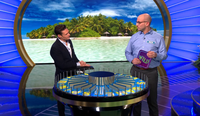Ryan Seacrest and Rich Rinaldi in a 'Wheel of Fortune' episode, Photo Credit: Wheel Of Fortune/Youtube