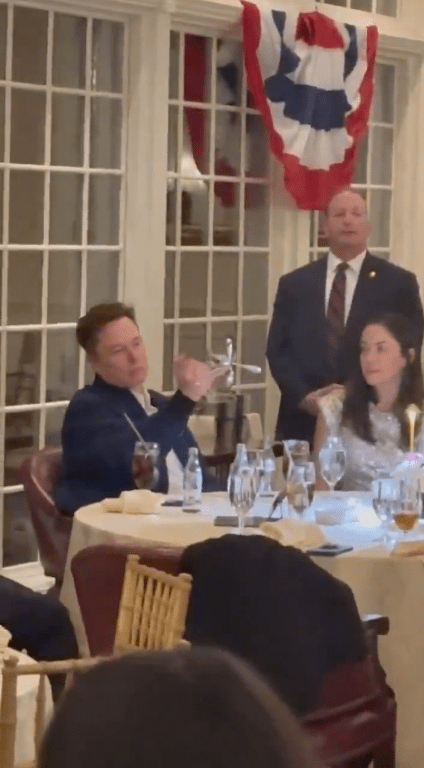 Elon Musk playing with cutlery while sitting at a table with Shivon Zilis, Photo Credit: Tesla Owners Silicon Valley/X