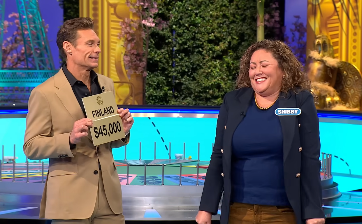 Show host Ryan Seacrest and contestant Shibby in a 'Wheel of Fortune' episode, Photo Credit: Wheel Of Fortune/Youtube