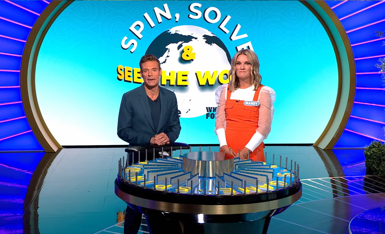 Show host Ryan Seacrest and contestant Mandy Jeter in a 'Wheel of Fortune' episode, Photo Credit: Wheel Of Fortune/Youtube