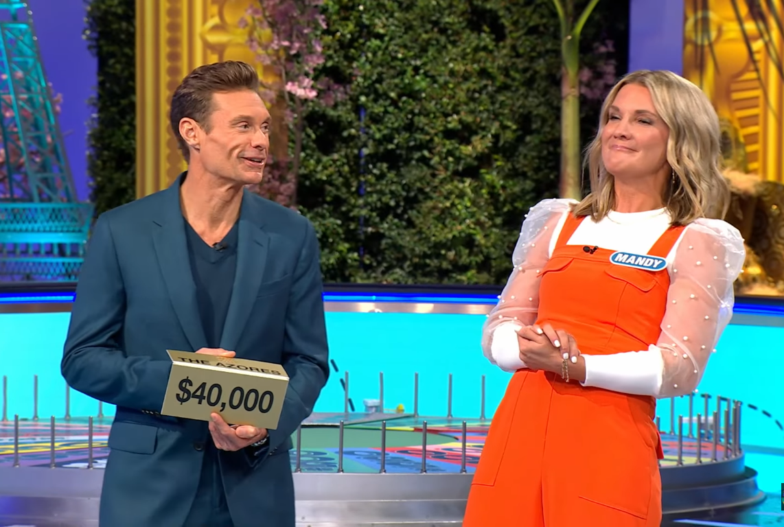 Show host Ryan Seacrest and contestant Mandy Jeter in a 'Wheel of Fortune' episode, Photo Credit: Wheel Of Fortune/Youtube