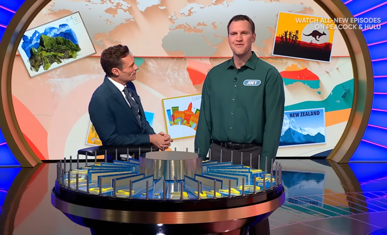 Show host Ryan Seacrest and contestant Joey Moorman in a 'Wheel of Fortune' episode, Photo Credit: Wheel of Fortune/Youtube