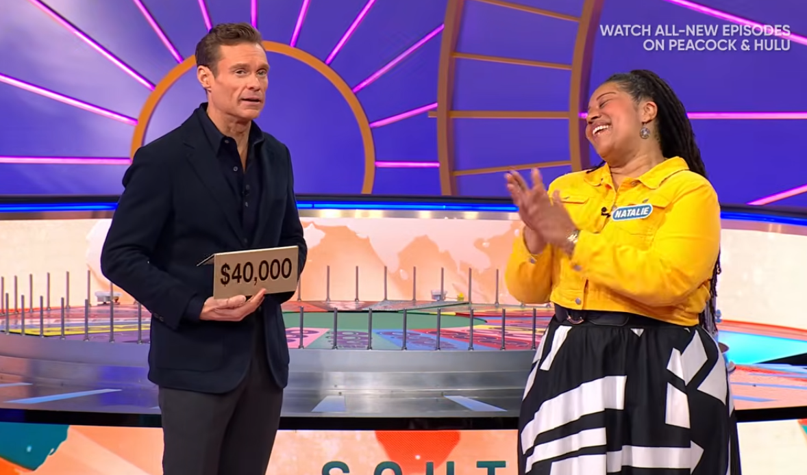 Show host Ryan Seacrest and contestant Natalie in a 'Wheel of Fortune' episode, Photo Credit: Wheel of Fortune/Youtube