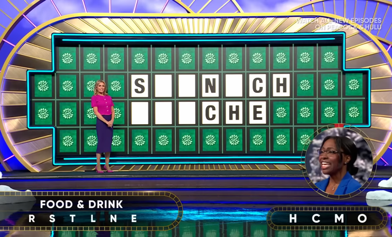 Show hostess Vanna White in a 'Wheel of Fortune' episode, Photo Credit: Wheel of Fortune/Youtube