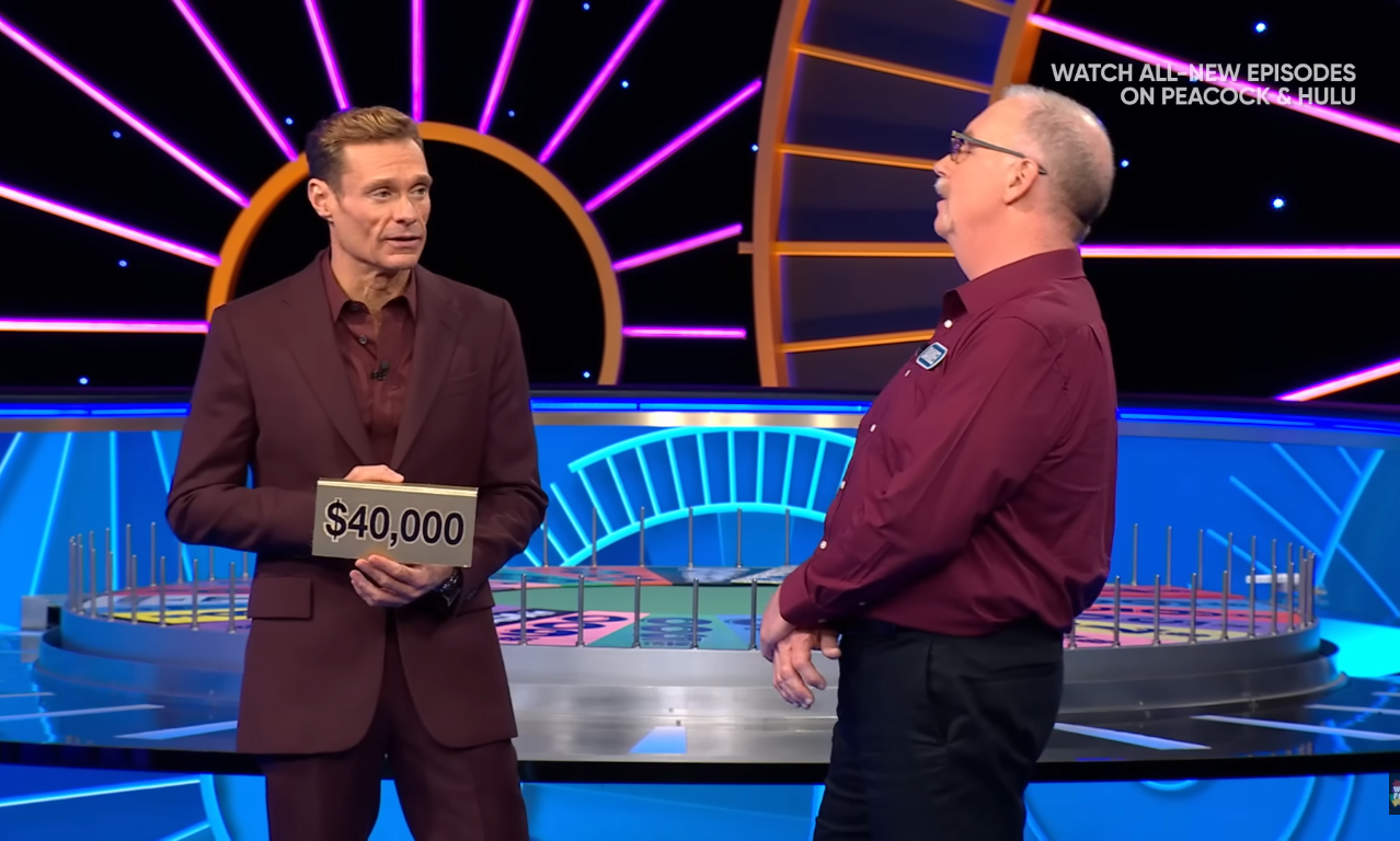 Show host Ryan Seacrest and contestant Daniel Whalen in a 'Wheel of Fortune' episode, Photo Credit: Wheel of Fortune/Youtube