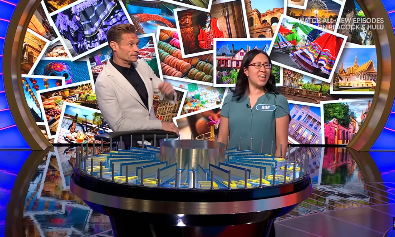 Show host Ryan Seacrest and contestant Sue Chong in a 'Wheel of Fortune' episode, Photo Credit: Wheel of Fortune/Youtube