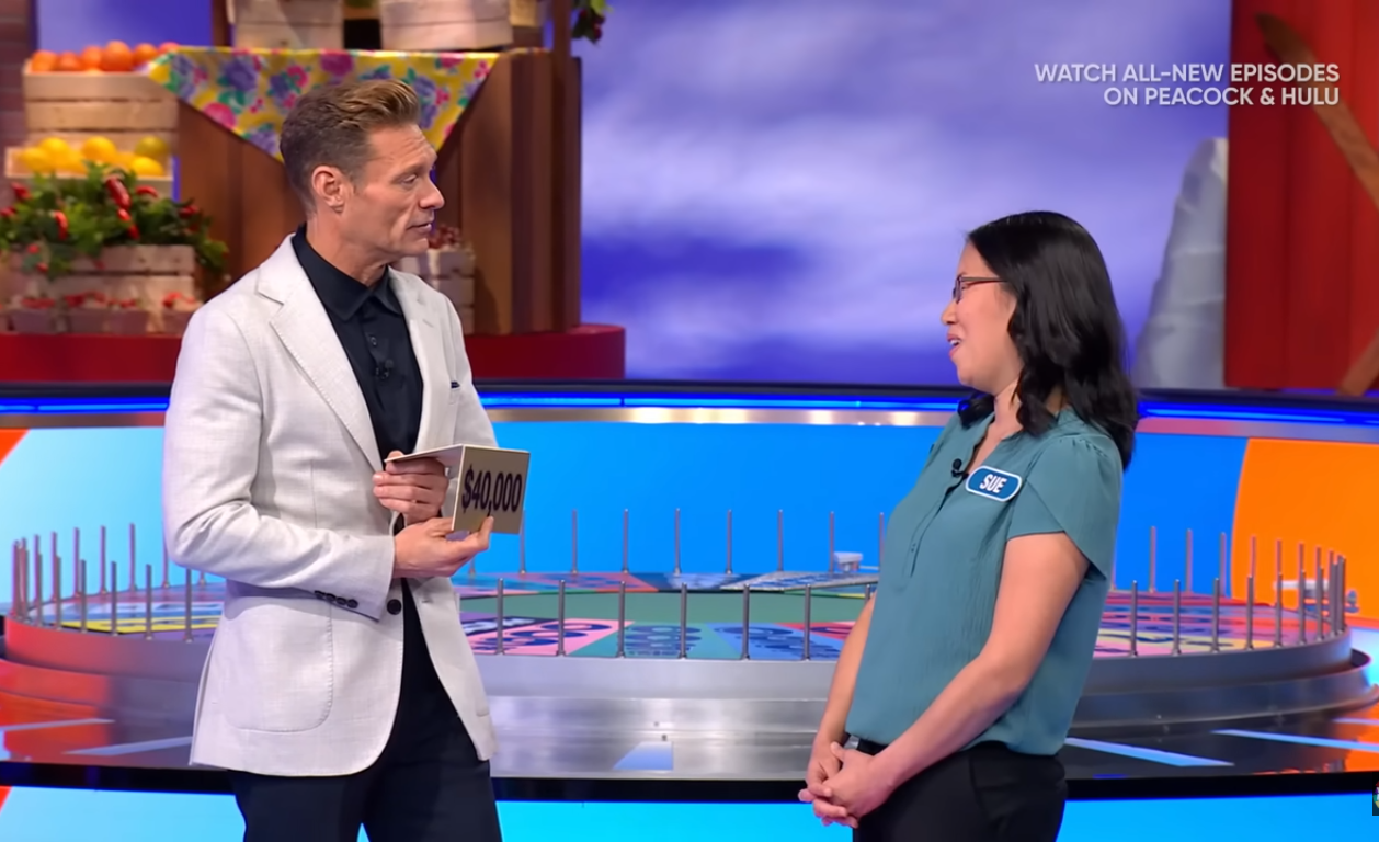 Show host Ryan Seacrest and contestant Sue Chong in a 'Wheel of Fortune' episode, Photo Credit: Wheel of Fortune/Youtube