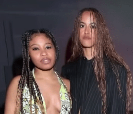 Malia Ann, formerly known as Malia Obama, posing with another woman at an event, Photo Credit: Entertainment Tonight/Youtube