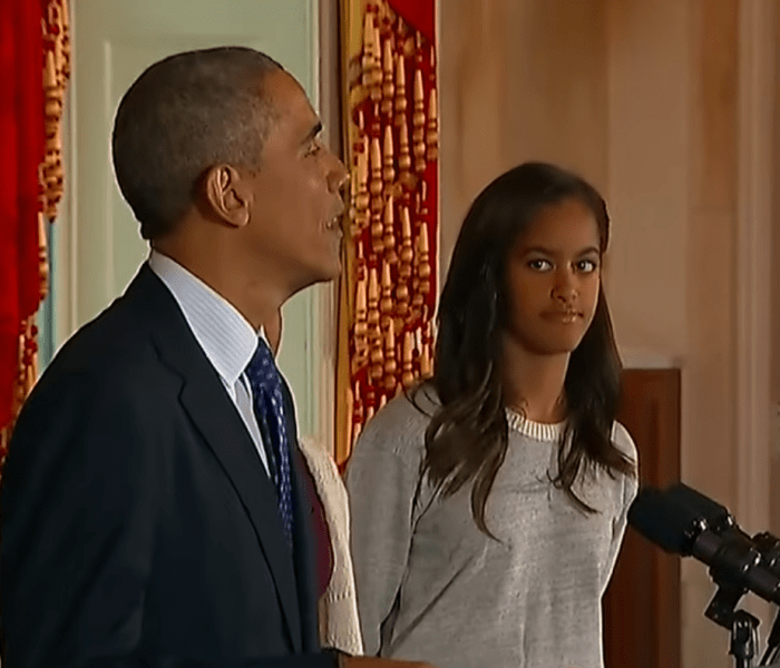 Malia Ann, formerly known as Malia Obama, next to her dad when he was in office, Photo Credit: Entertainment Tonight/Youtube
