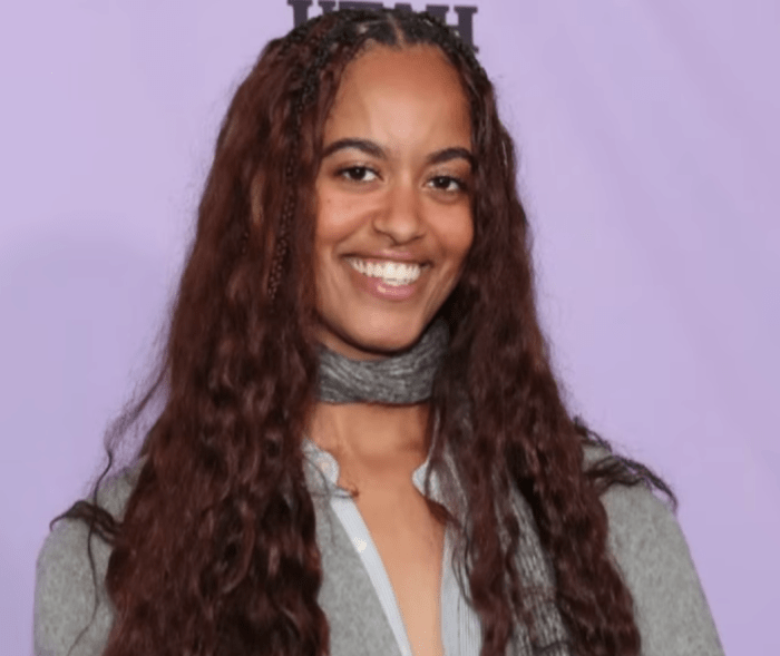 Malia Ann, formerly known as Malia Obama, smiling at a red carpet event, Photo Credit: Entertainment Tonight/Youtube