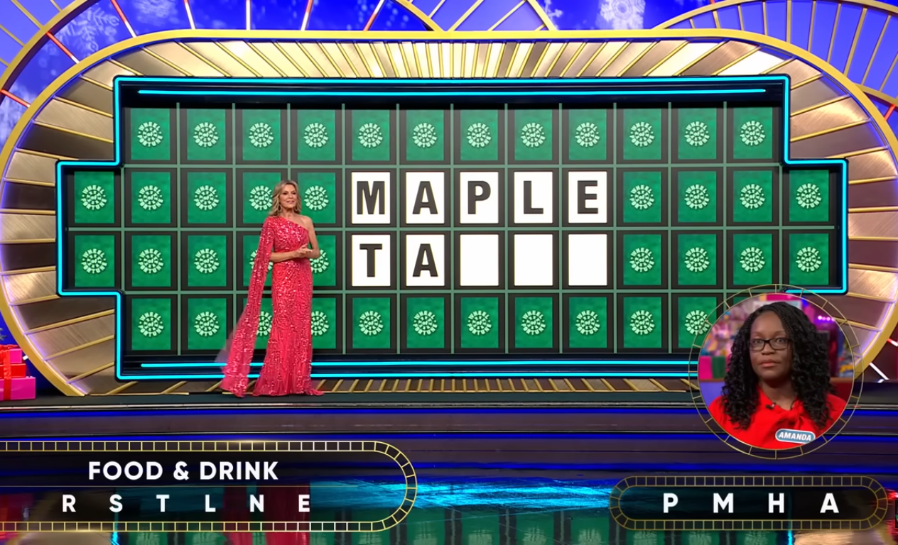 Show hostess Vanna White in a 'Wheel of Fortune' episode, Photo Credit: Wheel of Fortune/Youtube