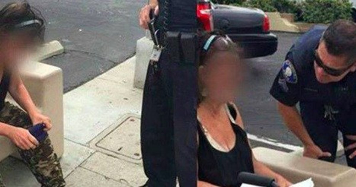 Cop Confronts Woman Acting Odd On Bench After Seeing What's By Her Promo Image