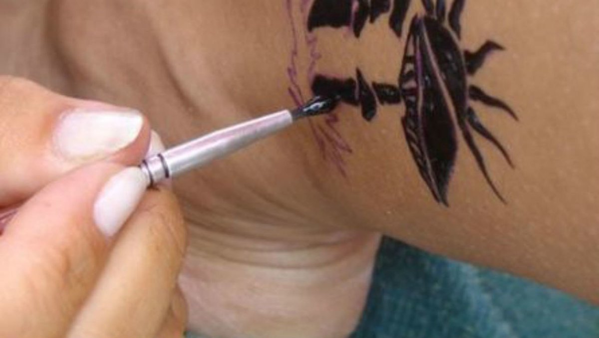 Woman Tattoos 'Vegan' On Forehead (Photo) Promo Image