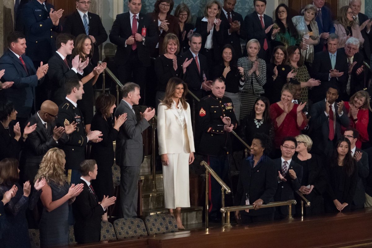 Melania Trump Wears White Amid All Black (Photos) Promo Image