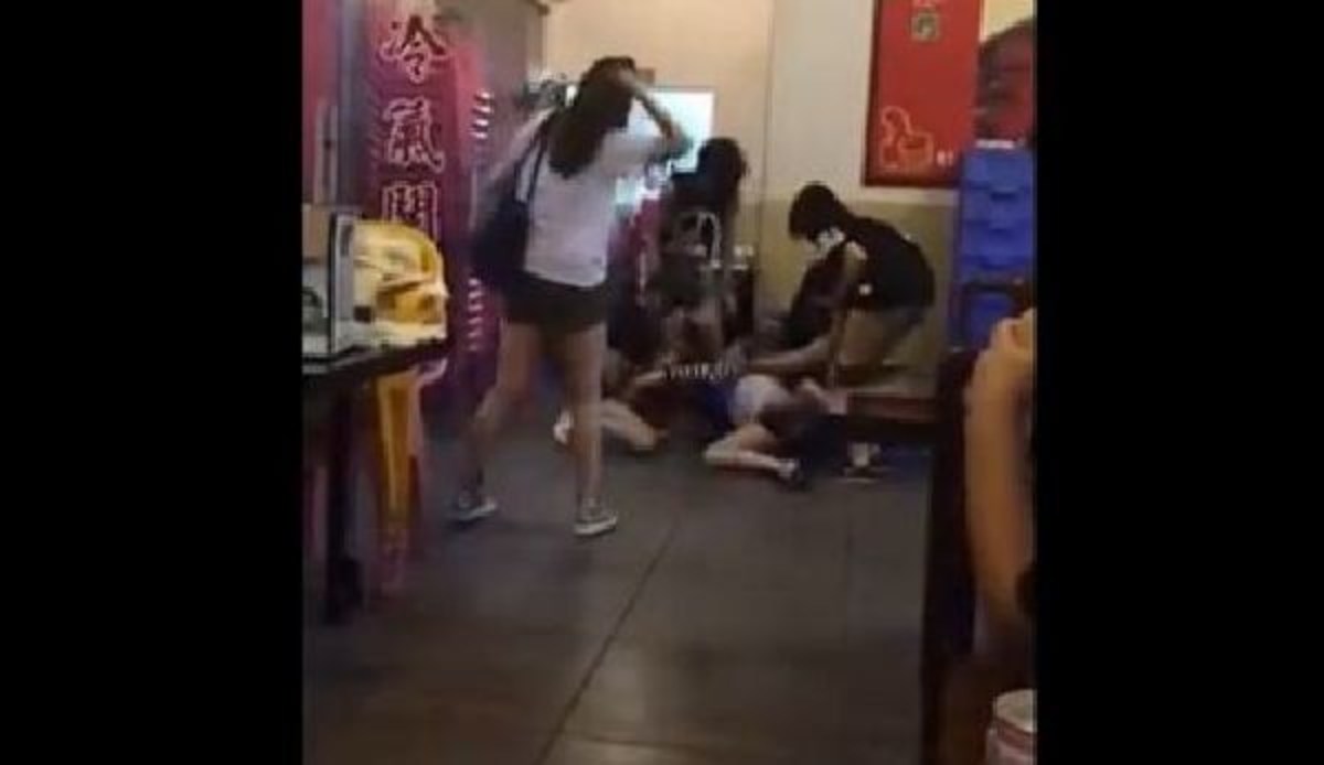 A recent viral video shows a man breaking up five girls attacking another g...