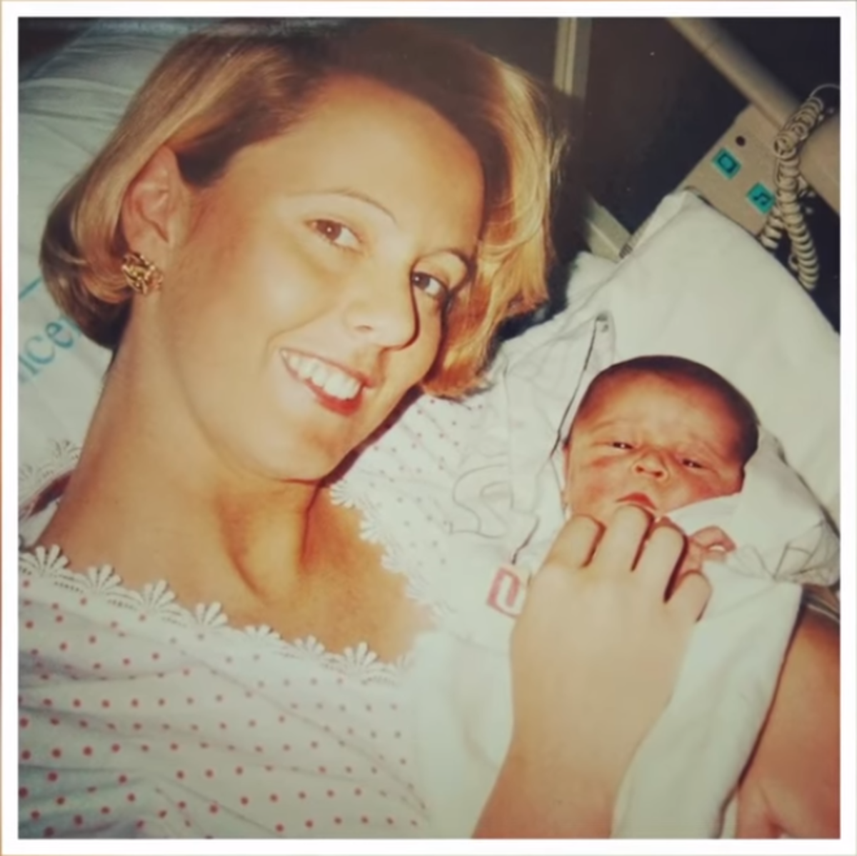 Carolyn Savage smiling at the camera with a newborn in her arms in the hospital, Photo Credit: Viral Stories/Youtube