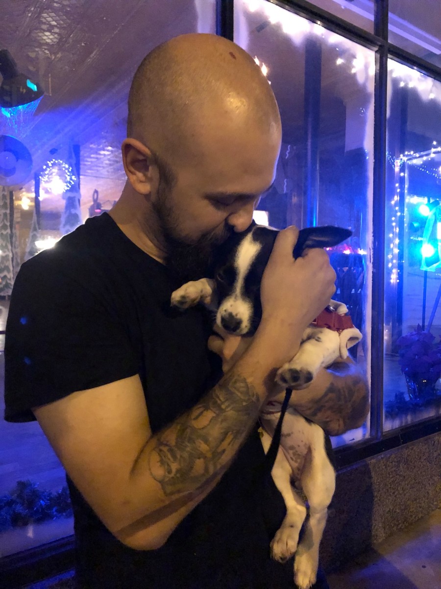 Zach Medlin holding a small dog posted to his Facebook, Photo Credit: Zach Medlin/Facebook