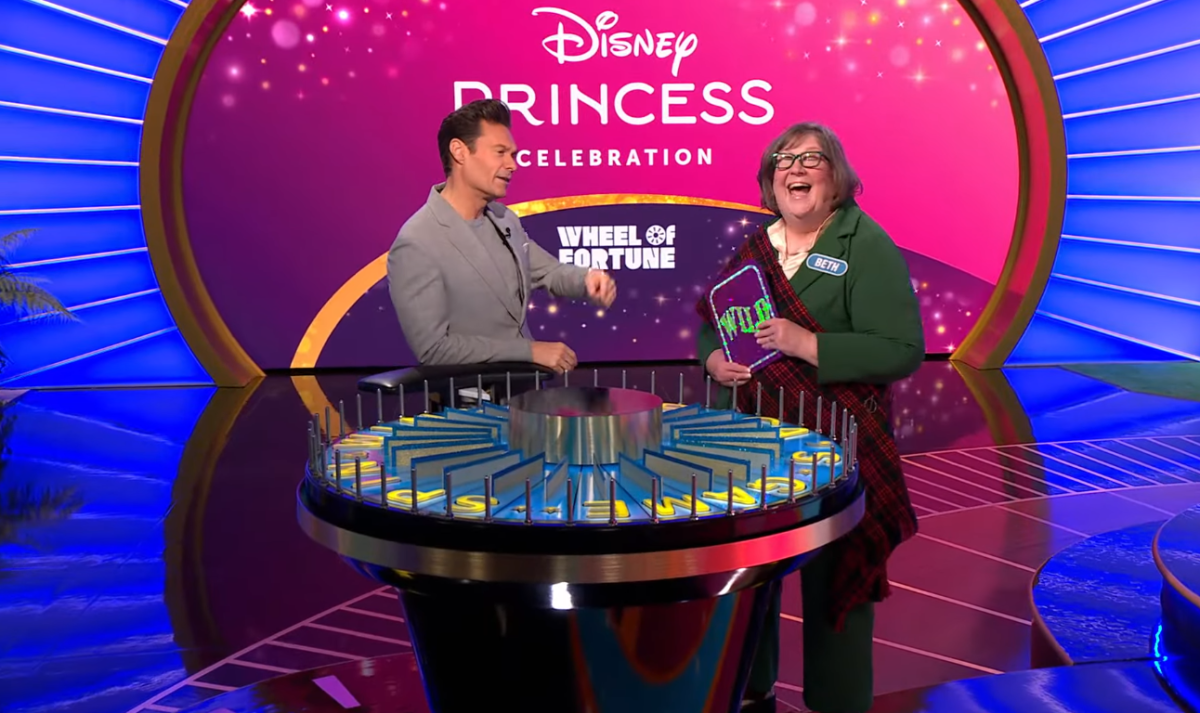 Show host Ryan Seacrest and Beth Barbee in a 'Wheel of Fortune' episode, Photo Credit: Wheel of Fortune/Youtube