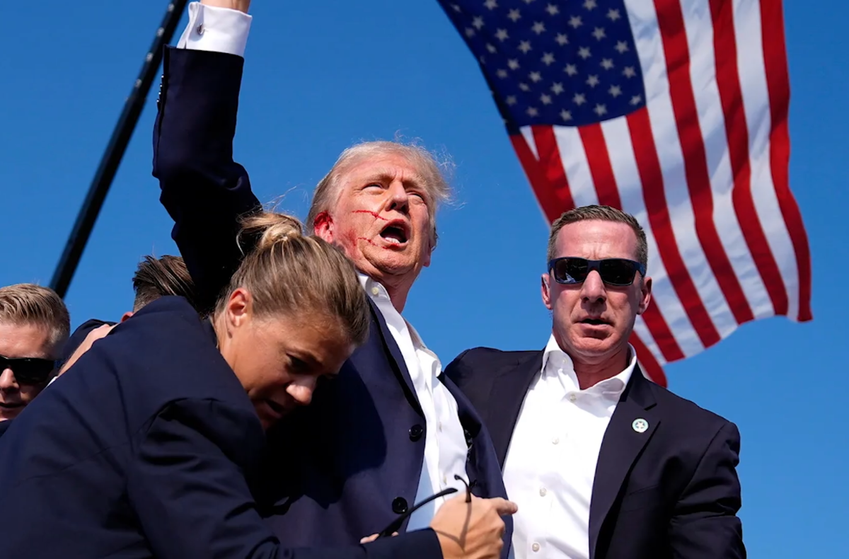 Donald Trump with his bodyguards after the assassination attempt, Photo Credit: The Daily Guardian/Youtube