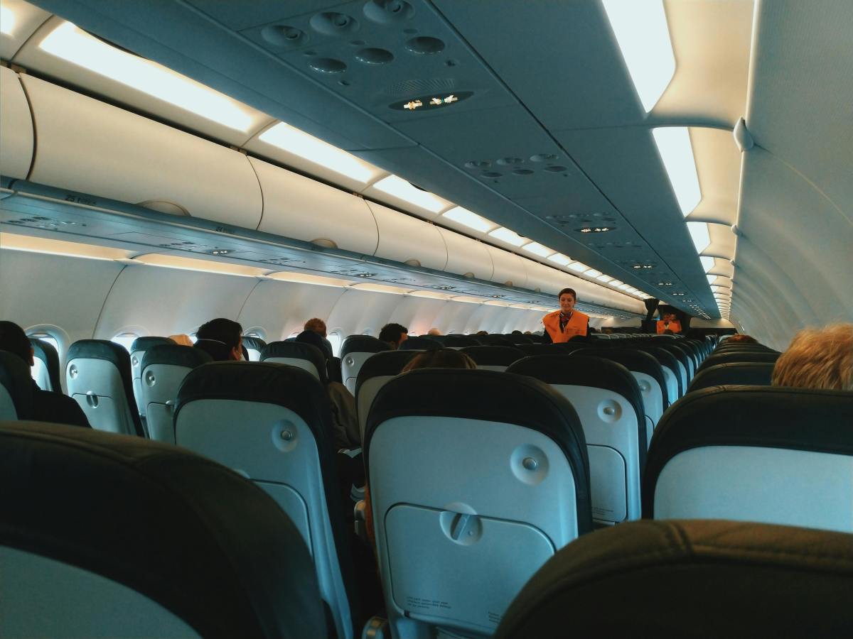 Cabin of aircraft with passengers on board, Photo Credit: Pexels