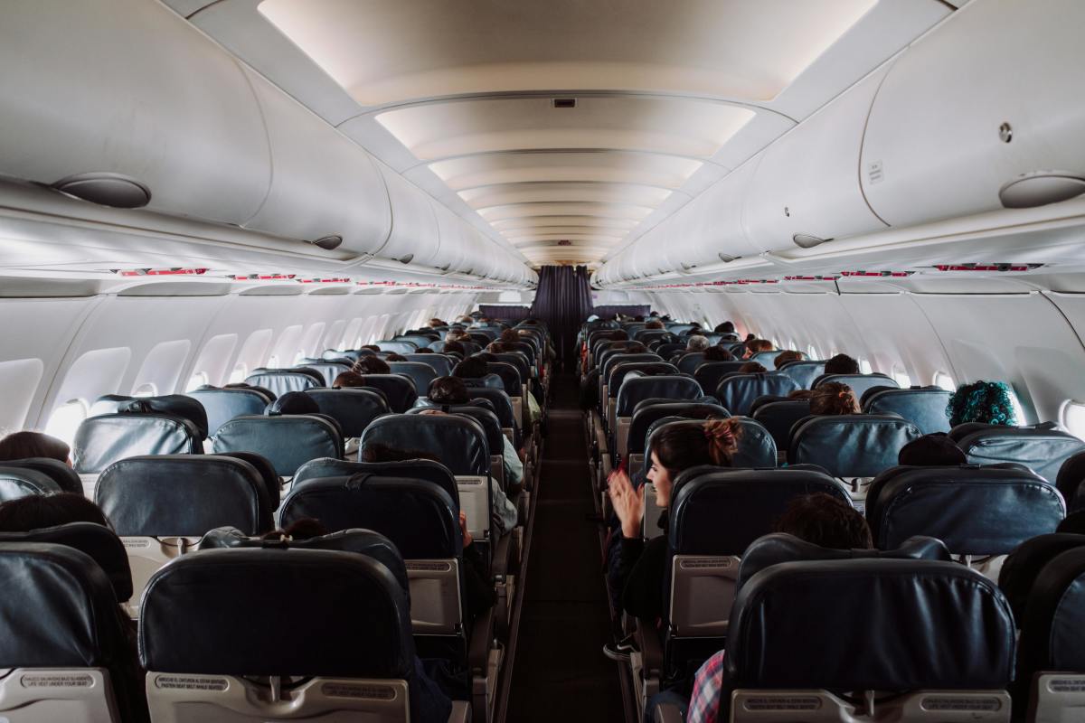 Airplane passengers seated inside a plane, Photo Credit: Pexels