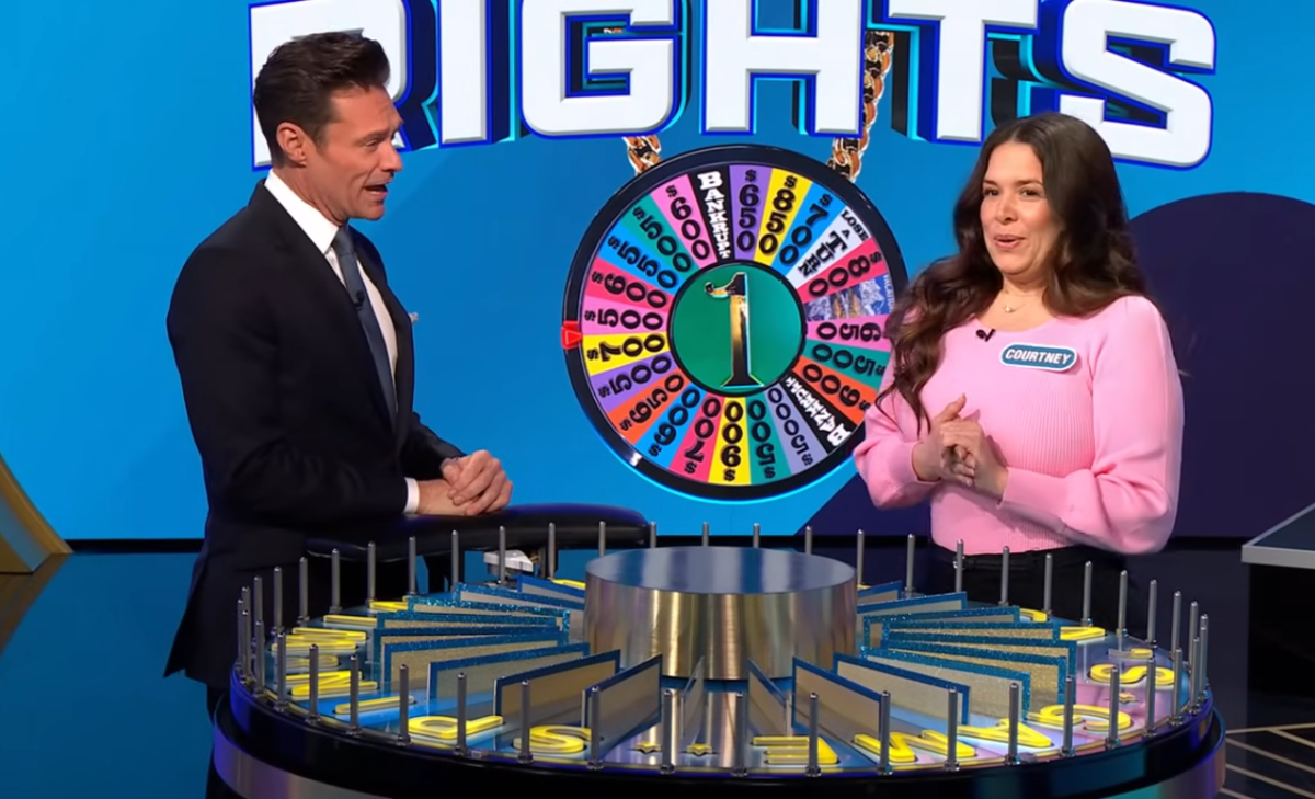 Show host Ryan Seacrest and contestant Courtney White in a 'Wheel of Fortune' episode, Photo Credit: Wheel of Fortune/Youtube