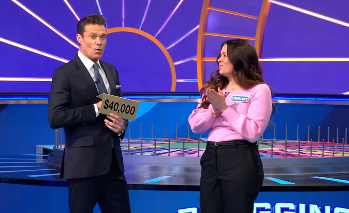 Show host Ryan Seacrest and contestant Courtney White in a 'Wheel of Fortune' episode, Photo Credit: Wheel of Fortune/Youtube