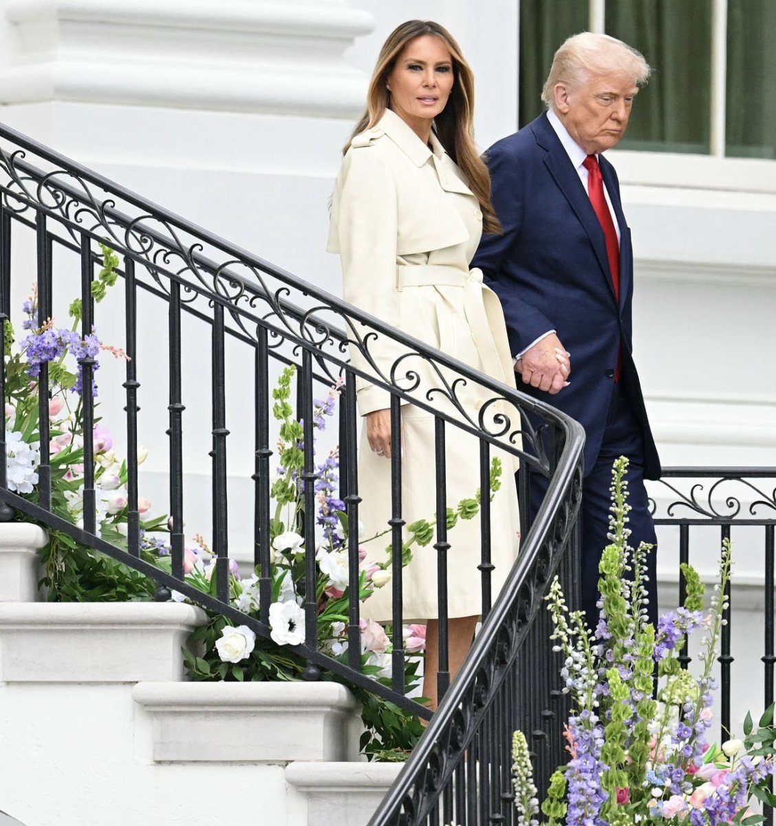 President Donald Trump and First Lady Melania Trump walk down the stairs during the annual Easter Egg Roll at the White House, Photo Credit: FLOTUS Report/X