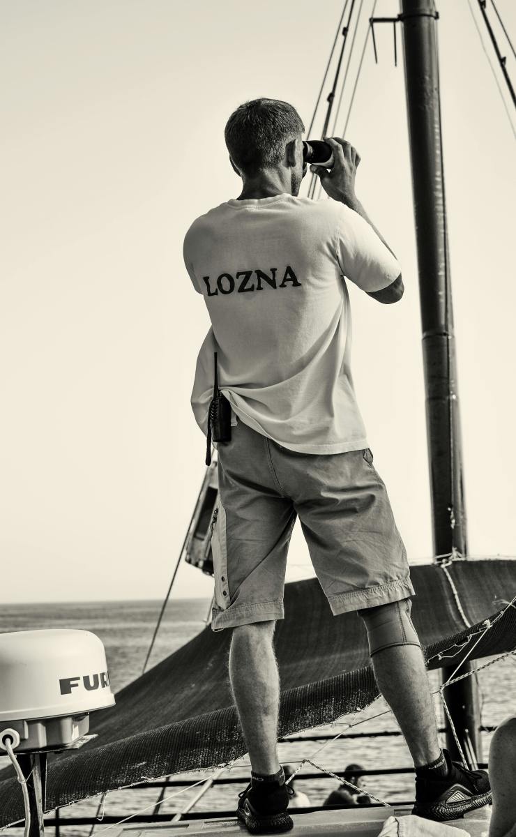 Man Looking through Binoculars on a Sailboat, Photo Credit: Pexels
