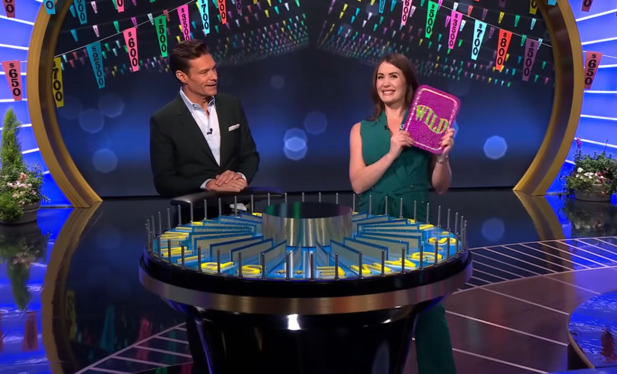 Show host Ryan Seacrest and contestant Sheree Corder in a 'Wheel of Fortune' episode, Photo Credit: Wheel of Fortune/Youtube