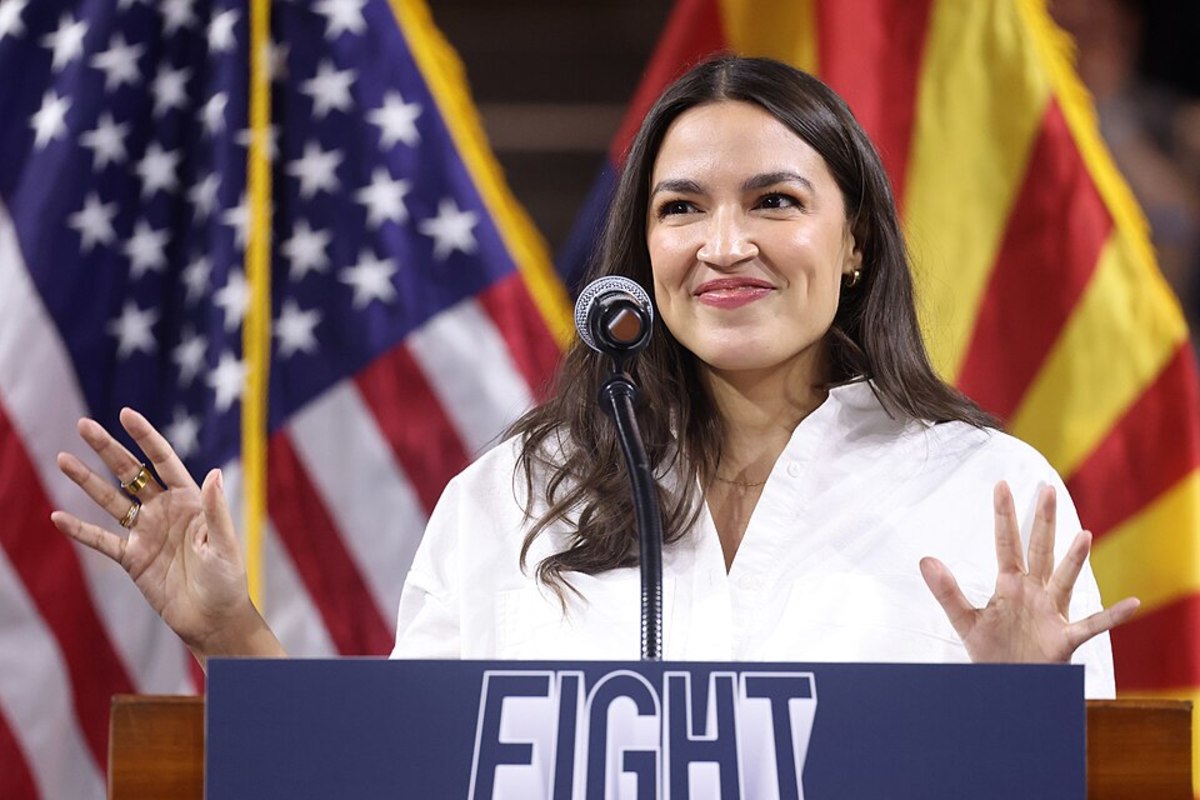 U.S. Congresswoman Alexandria Ocasio-Cortez speaking with attendees at a "Fight Oligarchy" rally at Mullett Arena in Tempe, Arizona, Photo Credit: Wikimedia